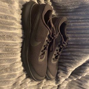 All Black Nike tennis shoes